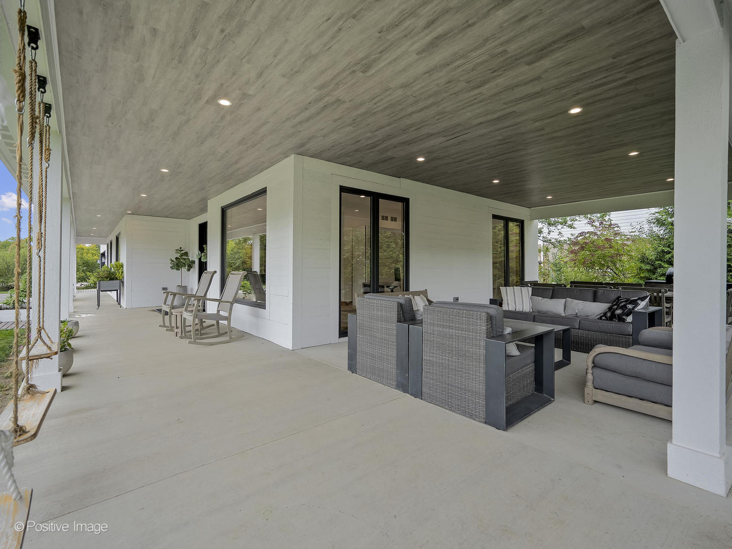 11670 79th Street Burr Ridge, IL 60527 - Photo 28 of 31 a living room with furniture a flat screen tv and a large window
