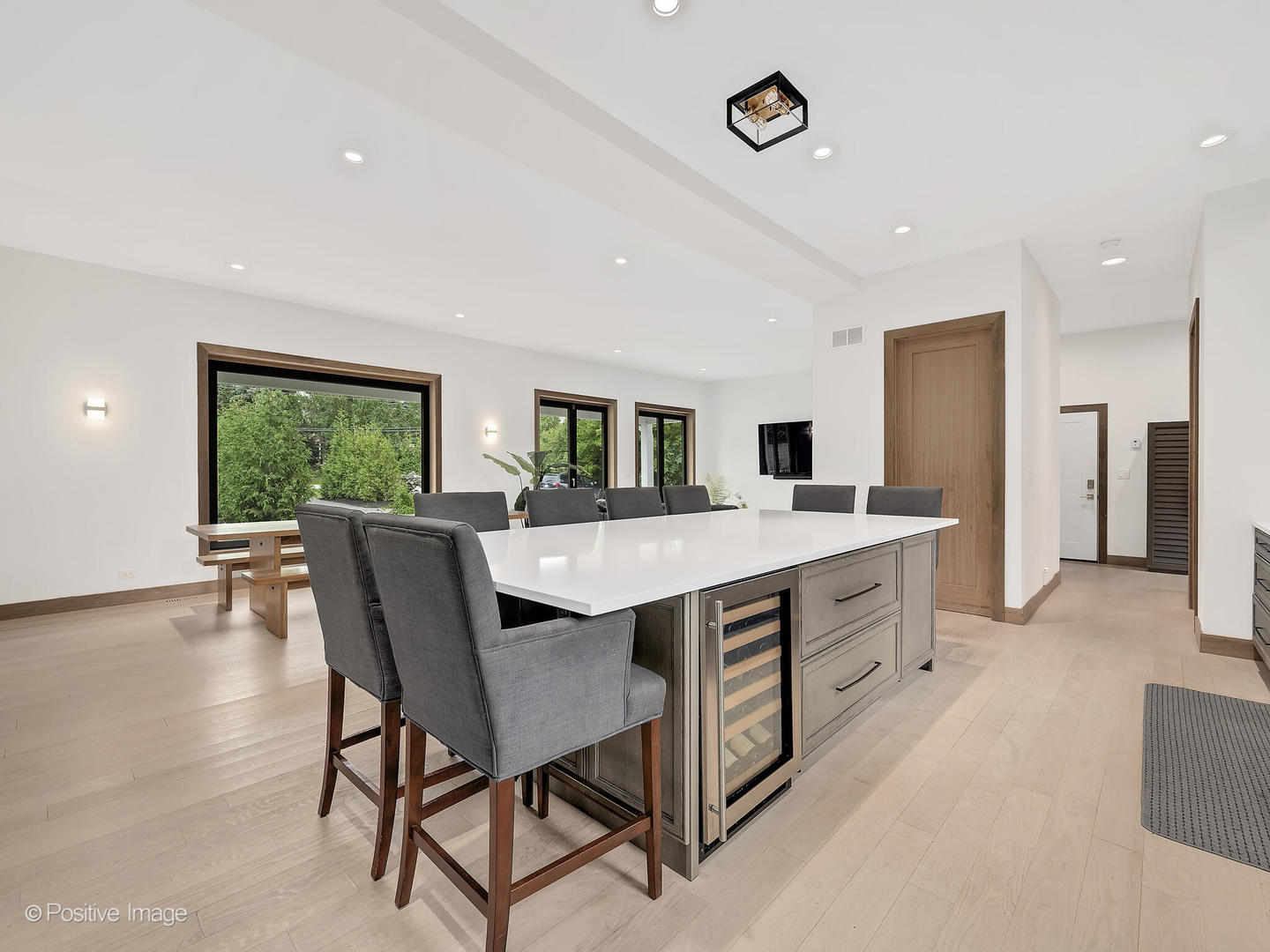 11670 79th Street Burr Ridge, IL 60527 - Photo 9 of 31 a kitchen with stainless steel appliances a table and chairs in it