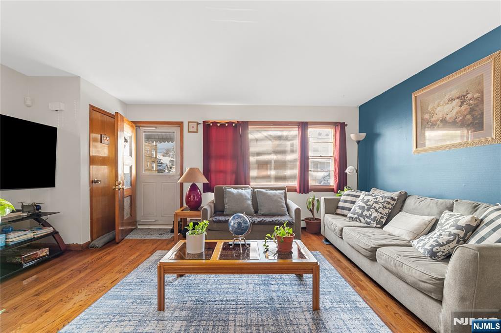 29 Harding Avenue North Arlington, NJ 07031 - Photo 11 of 44 a living room with furniture and a flat screen tv