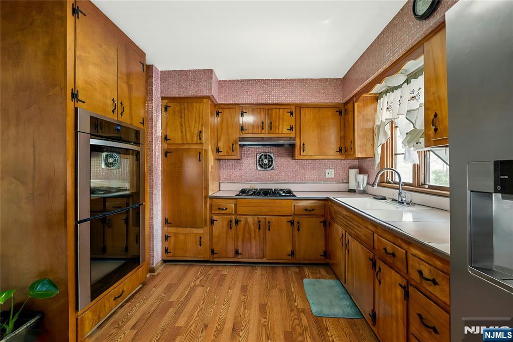 29 Harding Avenue North Arlington, NJ 07031 - Photo 17 of 44 a kitchen with stainless steel appliances granite countertop a stove a sink and a refrigerator