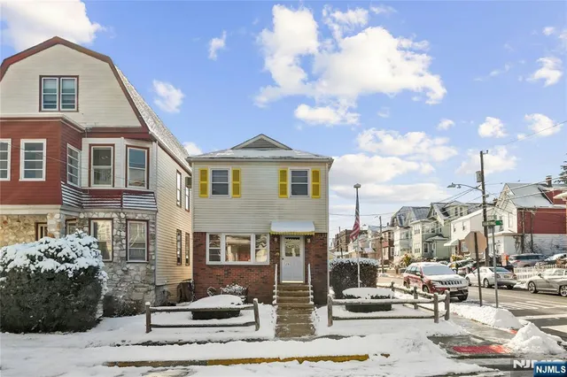 a view of a patio with table and chairs