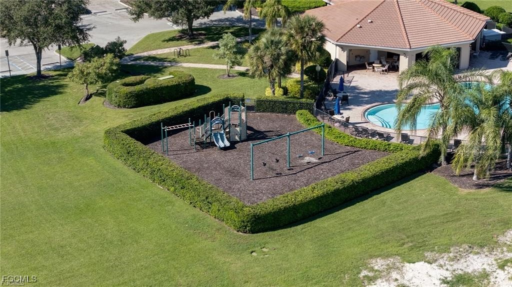 10749 Crossback Lane Lehigh Acres, FL 33974 - Photo 17 of 21 a garden view with a seating space