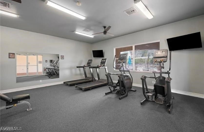 10749 Crossback Lane Lehigh Acres, FL 33974 - Photo 18 of 21 a view of a livingroom with workspace and a window