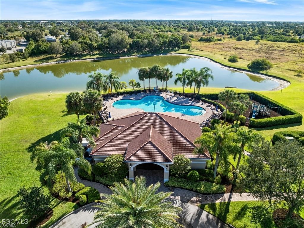 10749 Crossback Lane Lehigh Acres, FL 33974 - Photo 20 of 21 an aerial view of a house with a lake view