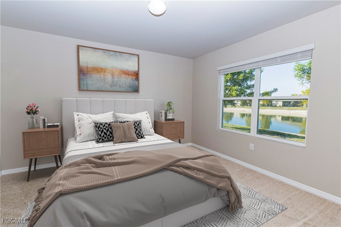 10749 Crossback Lane Lehigh Acres, FL 33974 - Photo 5 of 21 a bed sitting in a bedroom next to a window