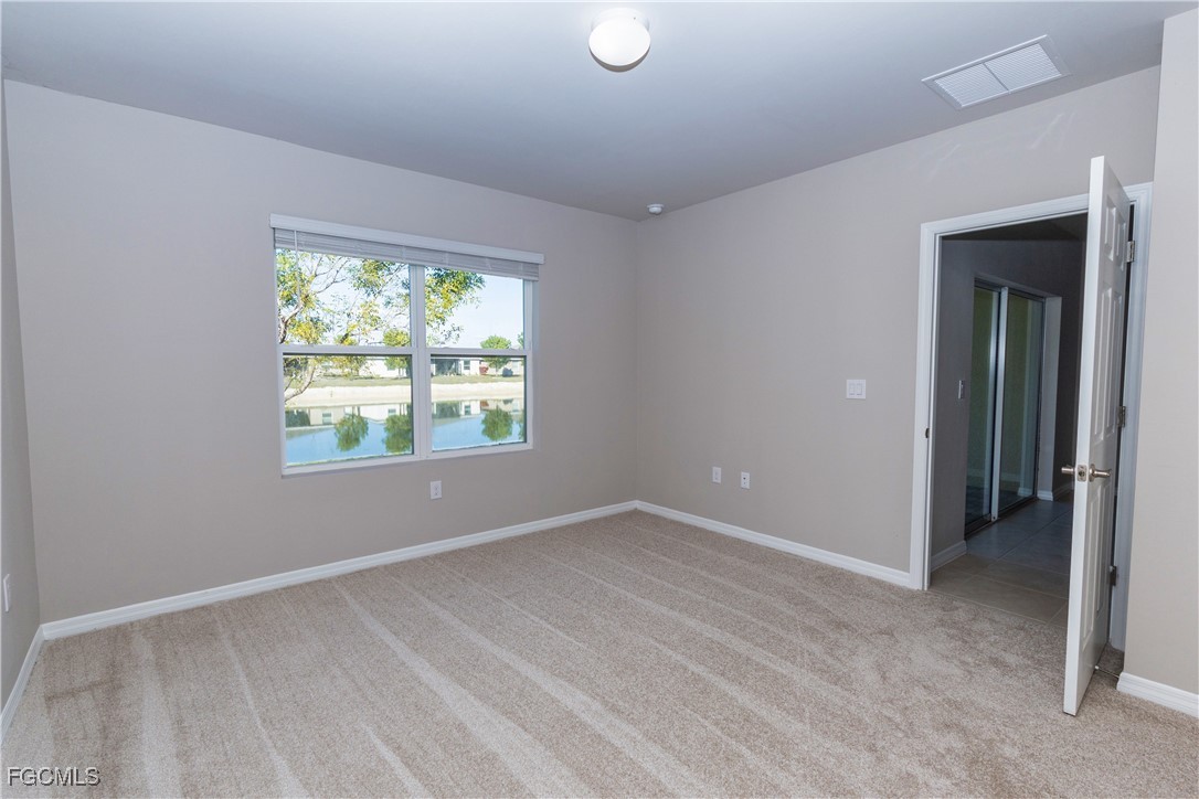 10749 Crossback Lane Lehigh Acres, FL 33974 - Photo 8 of 21 an empty room with windows