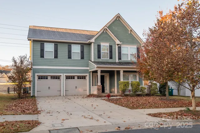 a view of a white house with a large windows