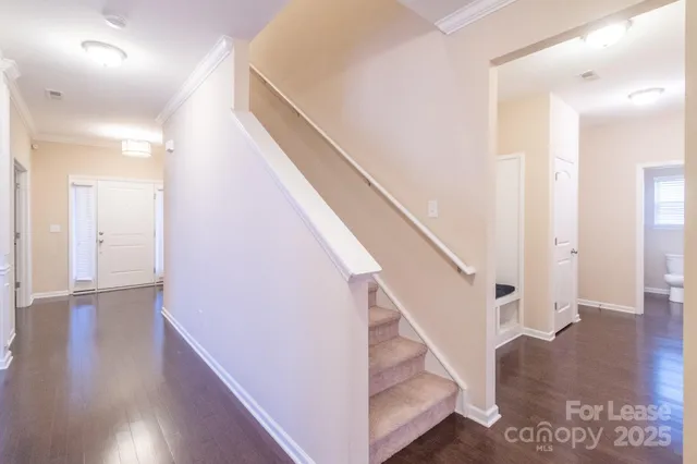 a view of entryway with wooden floor