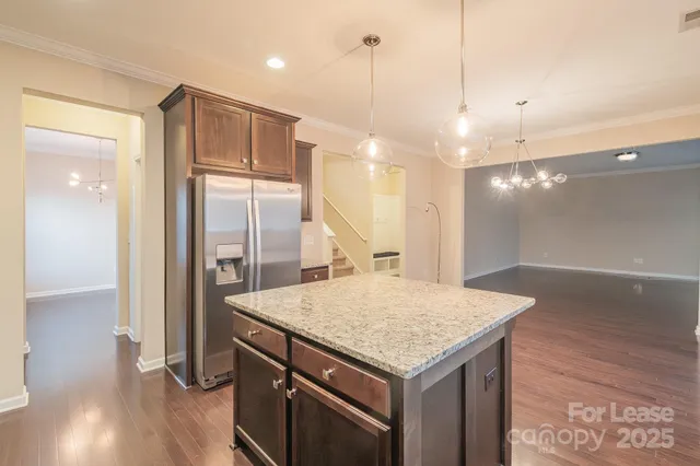a kitchen with a table and chairs in it