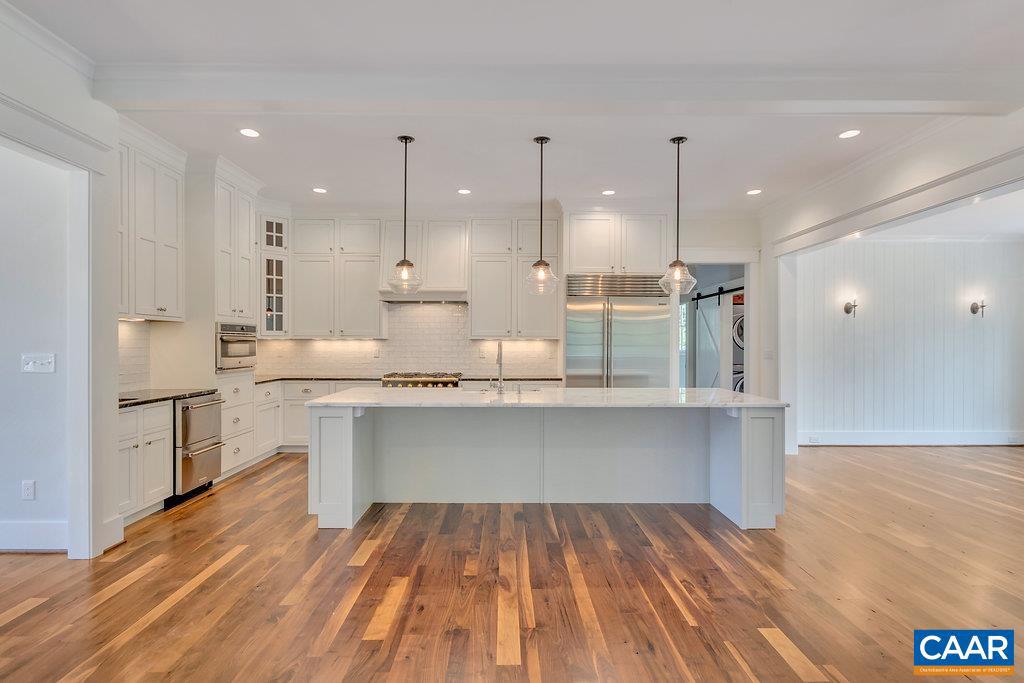 3 Acres Tbb Owensville Road, Unit G Charlottesville, VA 22901 - Photo 14 of 35 a open kitchen with kitchen island white cabinets and counter space