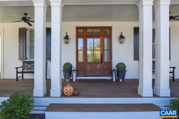 a view of living room filled with furniture and wooden floor