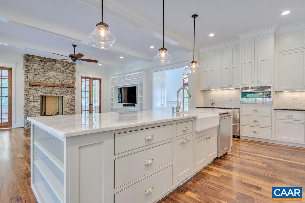 3 Acres Tbb Owensville Road, Unit G Charlottesville, VA 22901 - Photo 16 of 35 a kitchen with white cabinets and sink