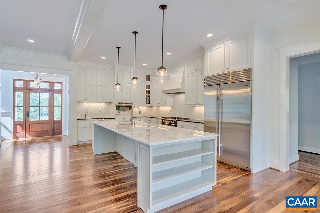 3 Acres Tbb Owensville Road, Unit G Charlottesville, VA 22901 - Photo 18 of 35 a kitchen with kitchen island a counter top space a sink appliances and a large window