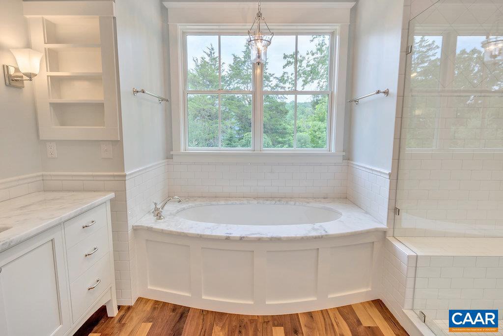 3 Acres Tbb Owensville Road, Unit G Charlottesville, VA 22901 - Photo 27 of 35 a white bath tub sitting in a bathroom