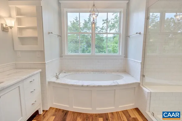 a white bath tub sitting in a bathroom