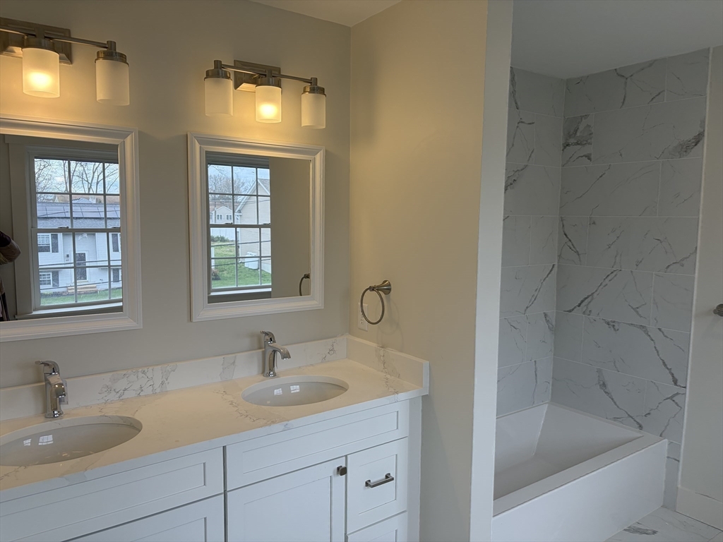 76 Valmor Street Worcester, MA 01604 - Photo 19 of 20 a bathroom with a sink and a bathtub