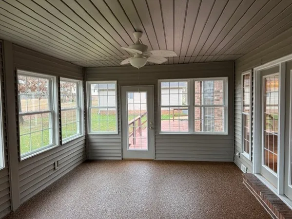 a view of room with window and furniture