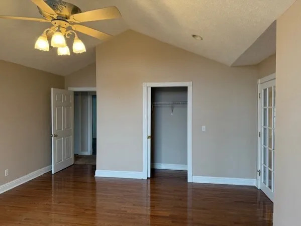 a view of room with window and wooden floor