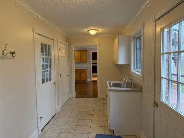 a bathroom with a sink and a washing machine
