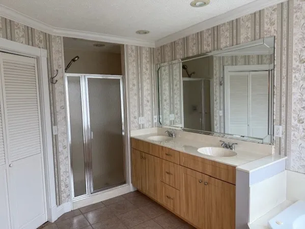 a bathroom with a shower sink and mirror