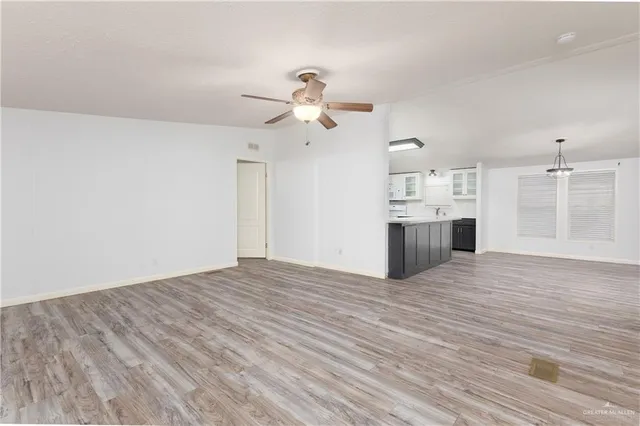 a view of a kitchen with a sink and a kitchen view