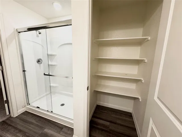 an empty room with a empty space and windows