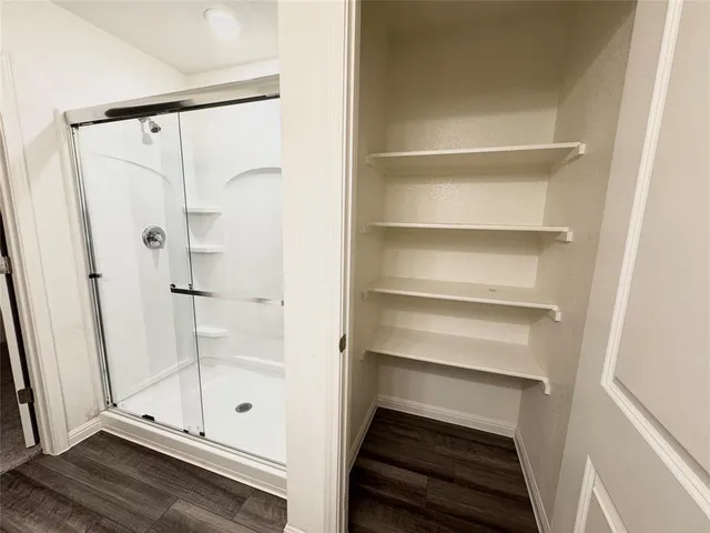 an empty room with a empty space and windows