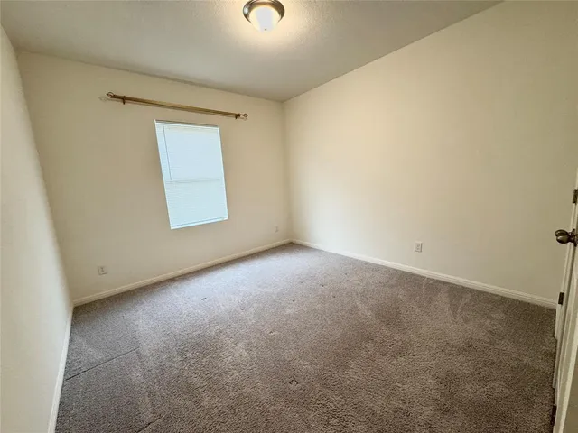 a view of walk in closet with wooden floor