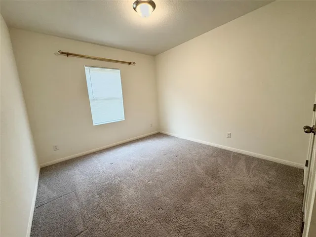 a view of walk in closet with wooden floor