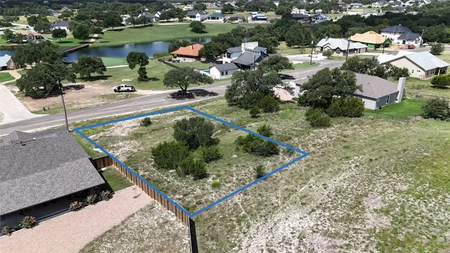 an aerial view of a house having yard