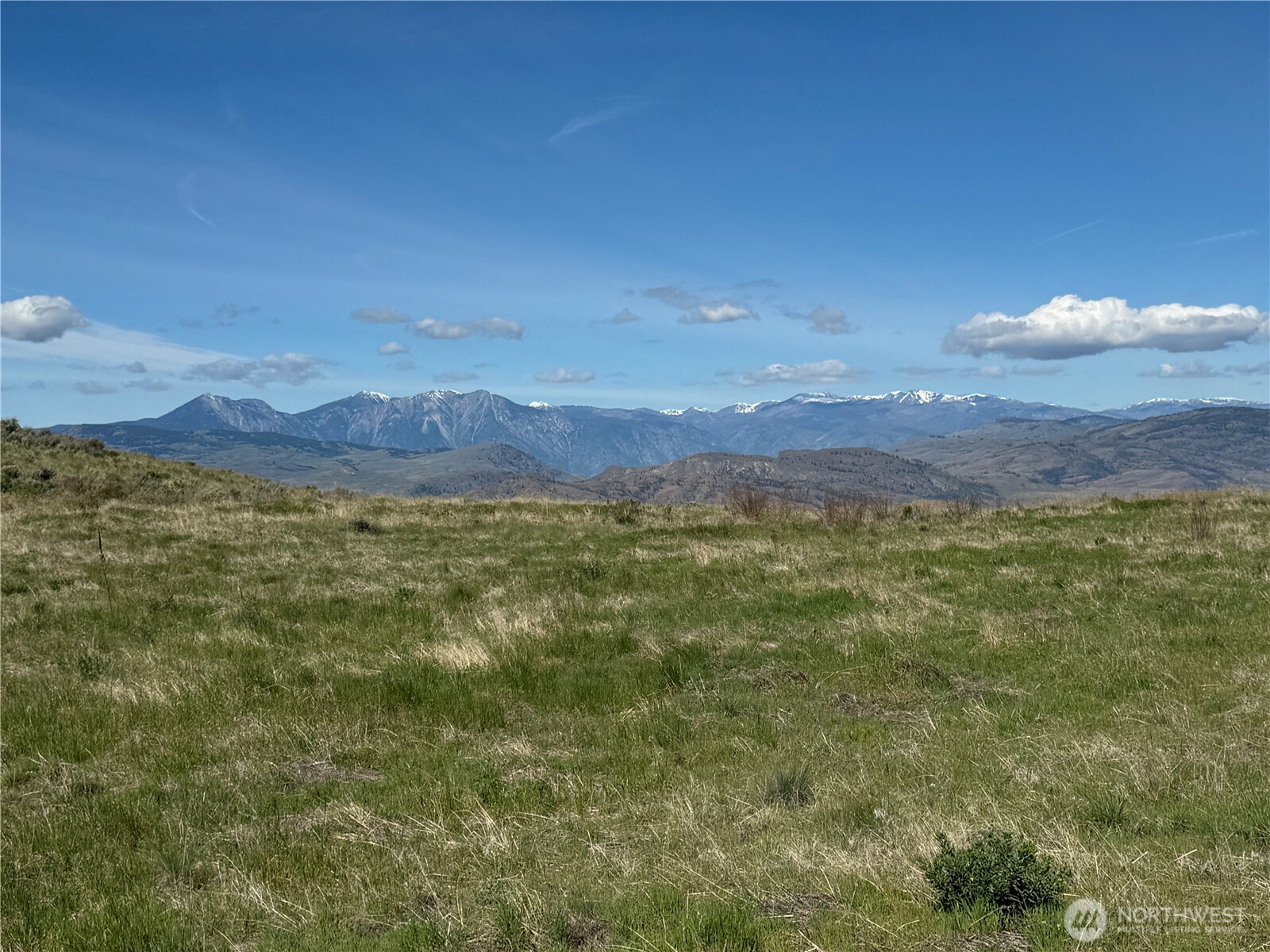 35 Sunset Ridge Road Oroville, WA 98844 - Photo 15 of 18 a view of a large mountain with mountains in the background