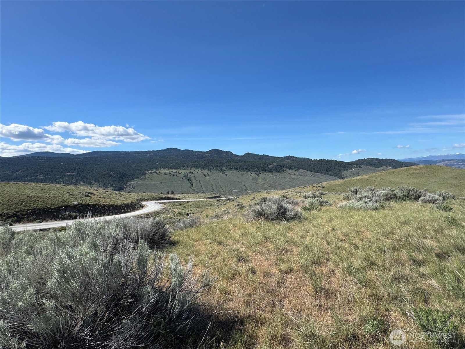 35 Sunset Ridge Road Oroville, WA 98844 - Photo 5 of 18 a view of lake with mountain