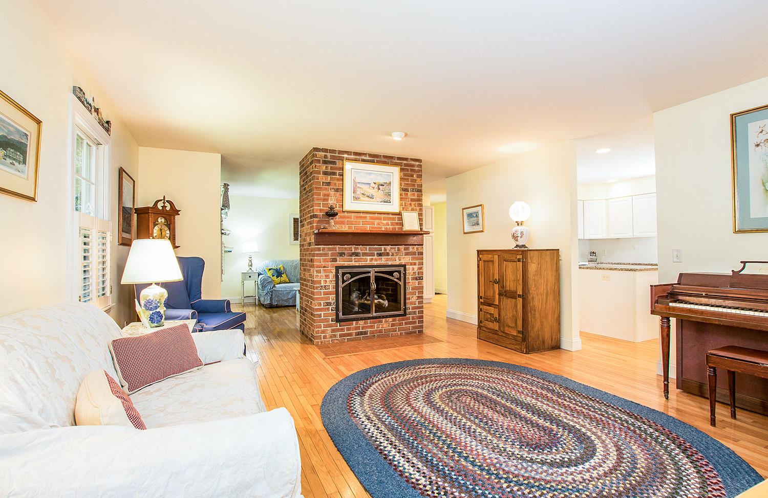 466 Training Field Road Chatham, MA 02633 - Photo 5 of 25 a living room with furniture and a fireplace