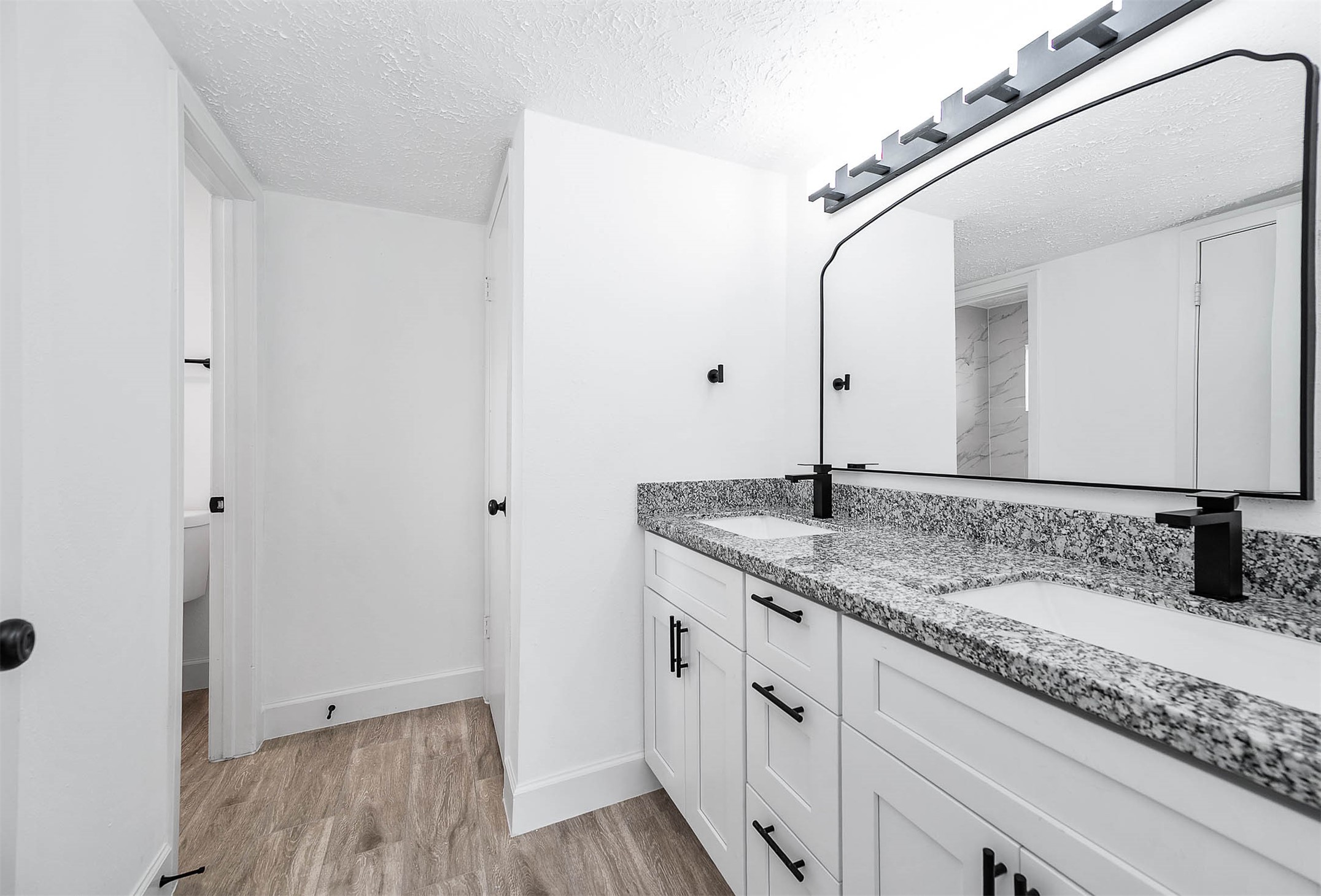 10402 Rancho Bernardo Lane Sugar Land, TX 77498 - Photo 21 of 30 a bathroom with a granite countertop sink and a mirror
