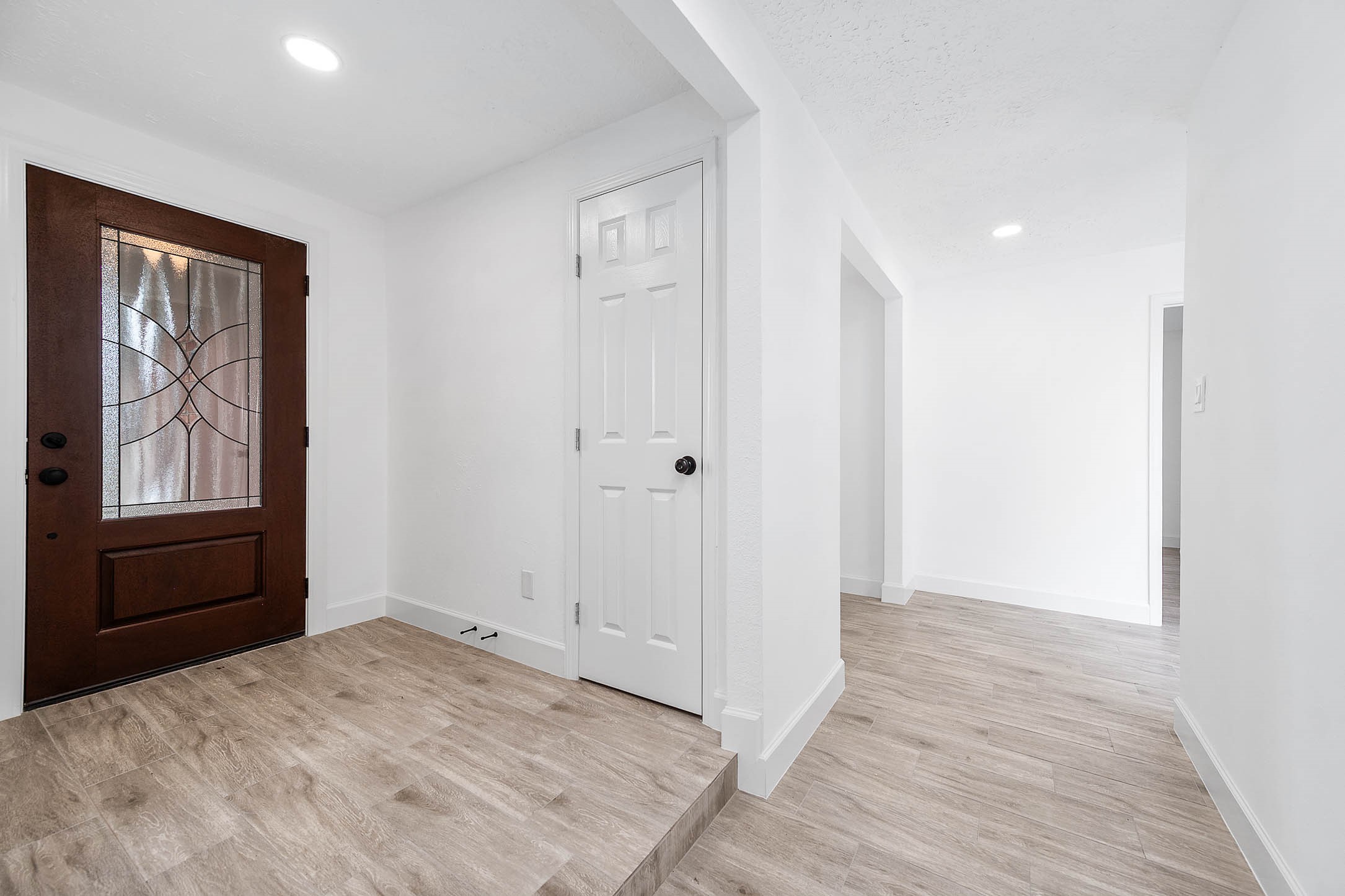 10402 Rancho Bernardo Lane Sugar Land, TX 77498 - Photo 6 of 30 a view of an empty room with wooden floor and a window