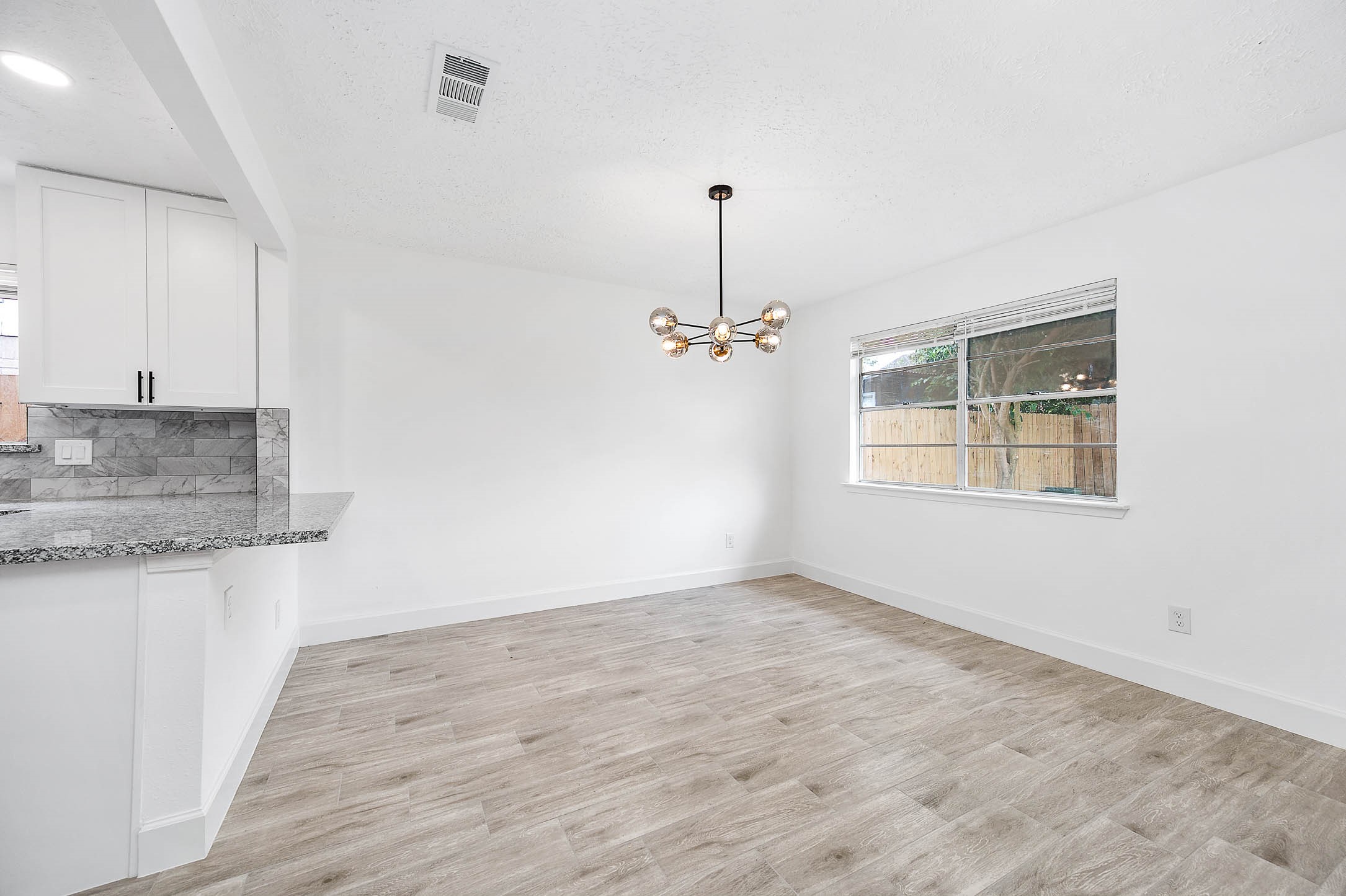 10402 Rancho Bernardo Lane Sugar Land, TX 77498 - Photo 7 of 30 a view of a kitchen with marble kitchen and a sink