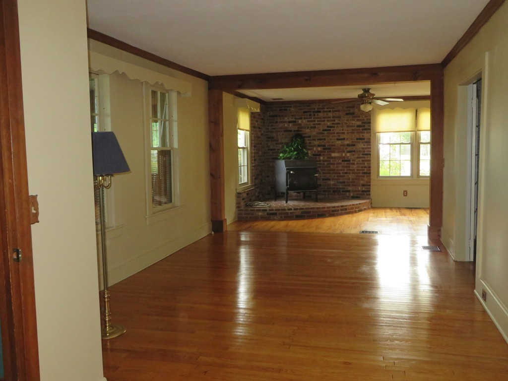 194 Turnpike Road Montague, MA 01351 - Photo 13 of 30 a view of a hallway with wooden floor and a large window