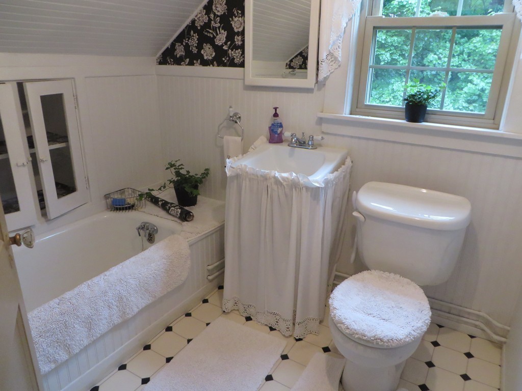 194 Turnpike Road Montague, MA 01351 - Photo 19 of 30 a bathroom with a sink a toilet and bathtub