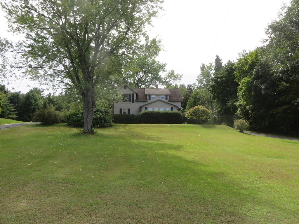 194 Turnpike Road Montague, MA 01351 - Photo 2 of 30 a view of a field of grass and trees