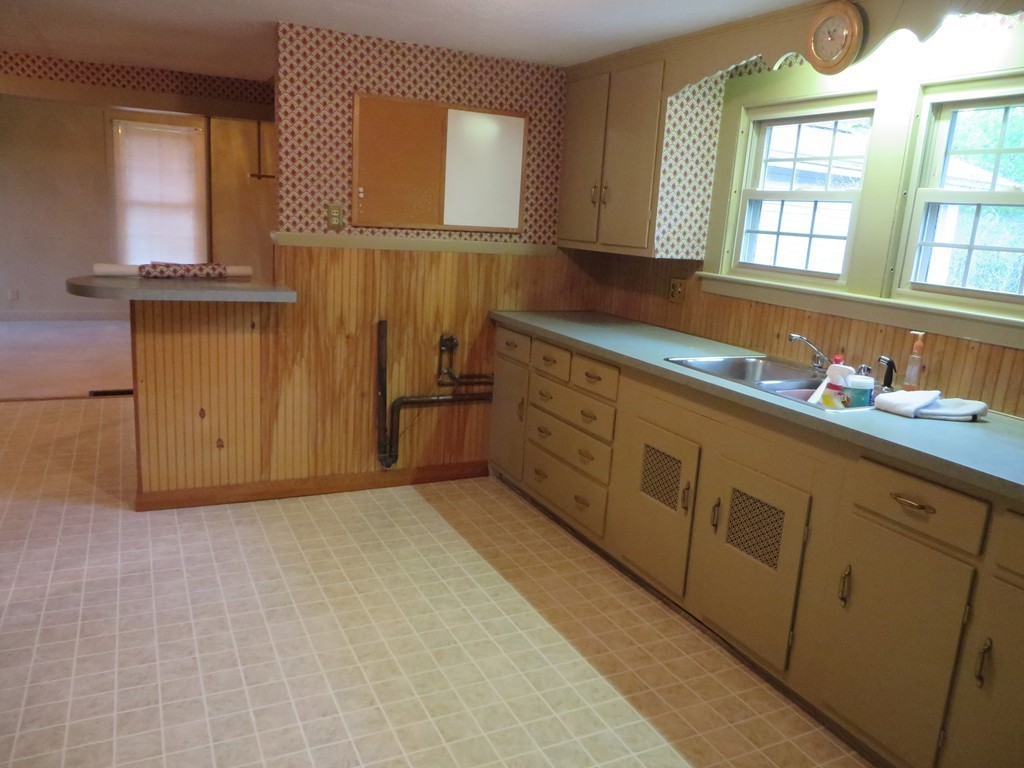 194 Turnpike Road Montague, MA 01351 - Photo 23 of 30 a kitchen with stainless steel appliances granite countertop a sink and cabinets