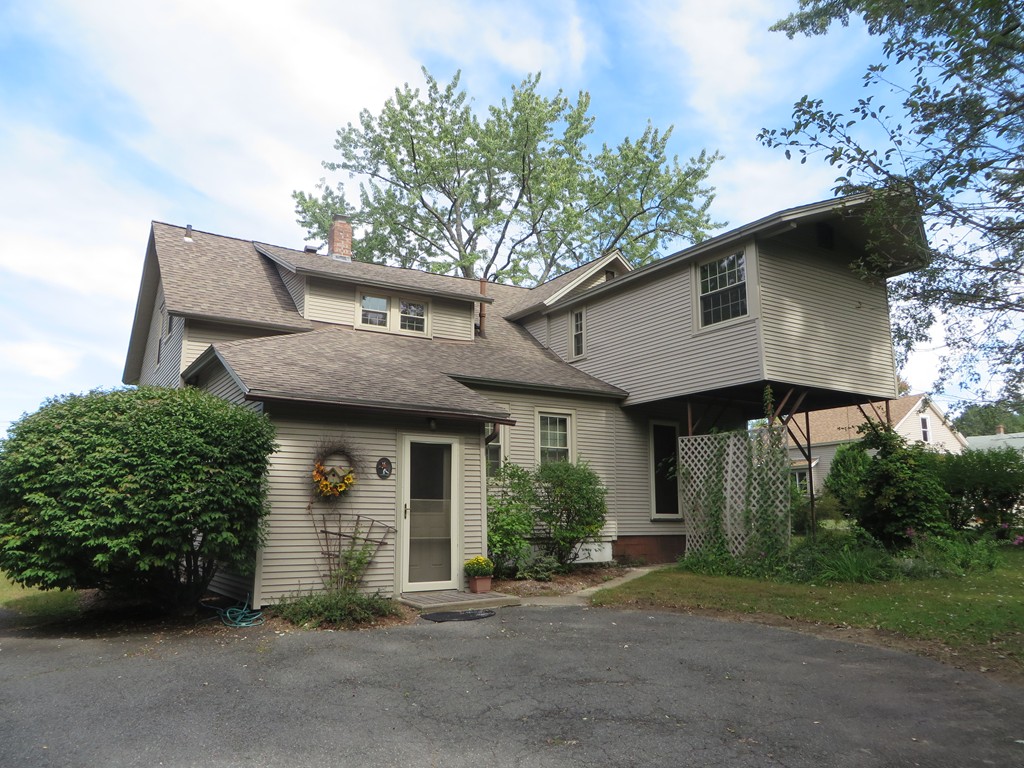 194 Turnpike Road Montague, MA 01351 - Photo 3 of 30 a front view of a house with a garden