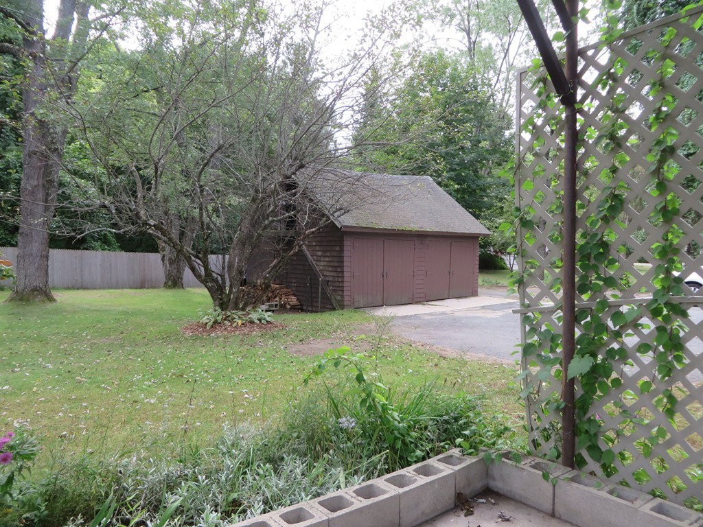 194 Turnpike Road Montague, MA 01351 - Photo 6 of 30 a backyard of a house with plants and large tree
