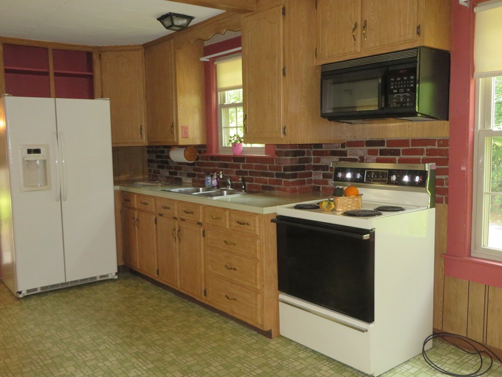 194 Turnpike Road Montague, MA 01351 - Photo 9 of 30 a kitchen with a stove and a microwave