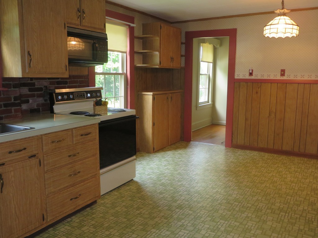 194 Turnpike Road Montague, MA 01351 - Photo 10 of 30 a kitchen with granite countertop cabinets and window