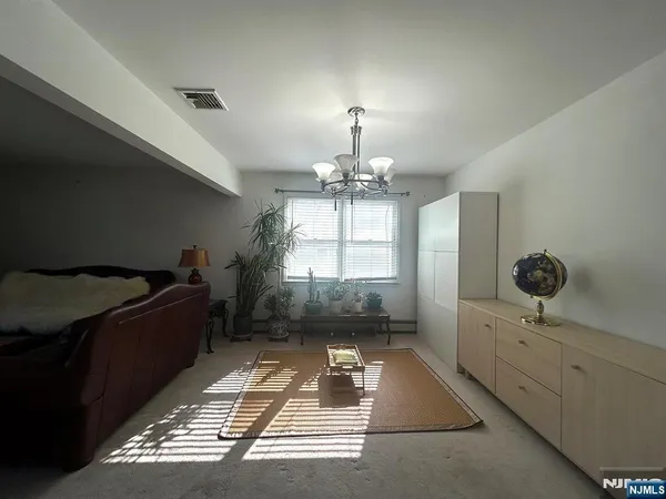 a view of a dining room with furniture and window