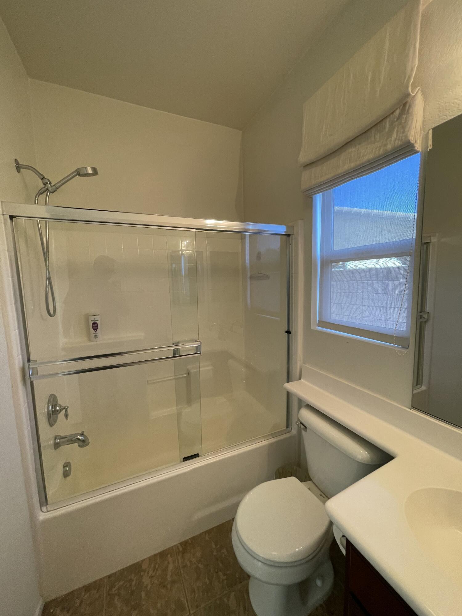 1122 Oro Ridge Palm Springs, CA 92262 - Photo 11 of 33 a bathroom with a toilet and a shower