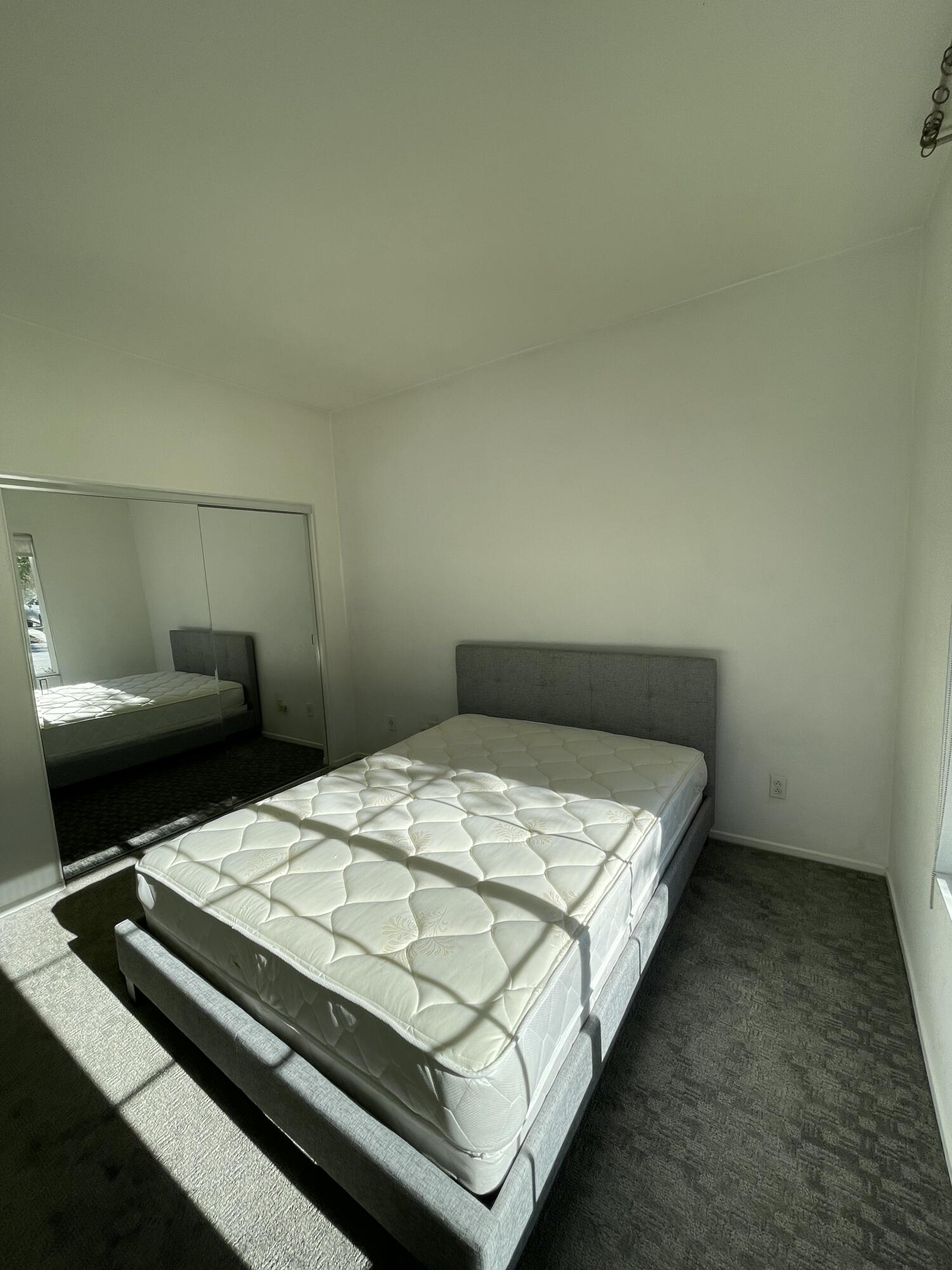 1122 Oro Ridge Palm Springs, CA 92262 - Photo 13 of 33 a bed sitting in a bedroom next to a larger window