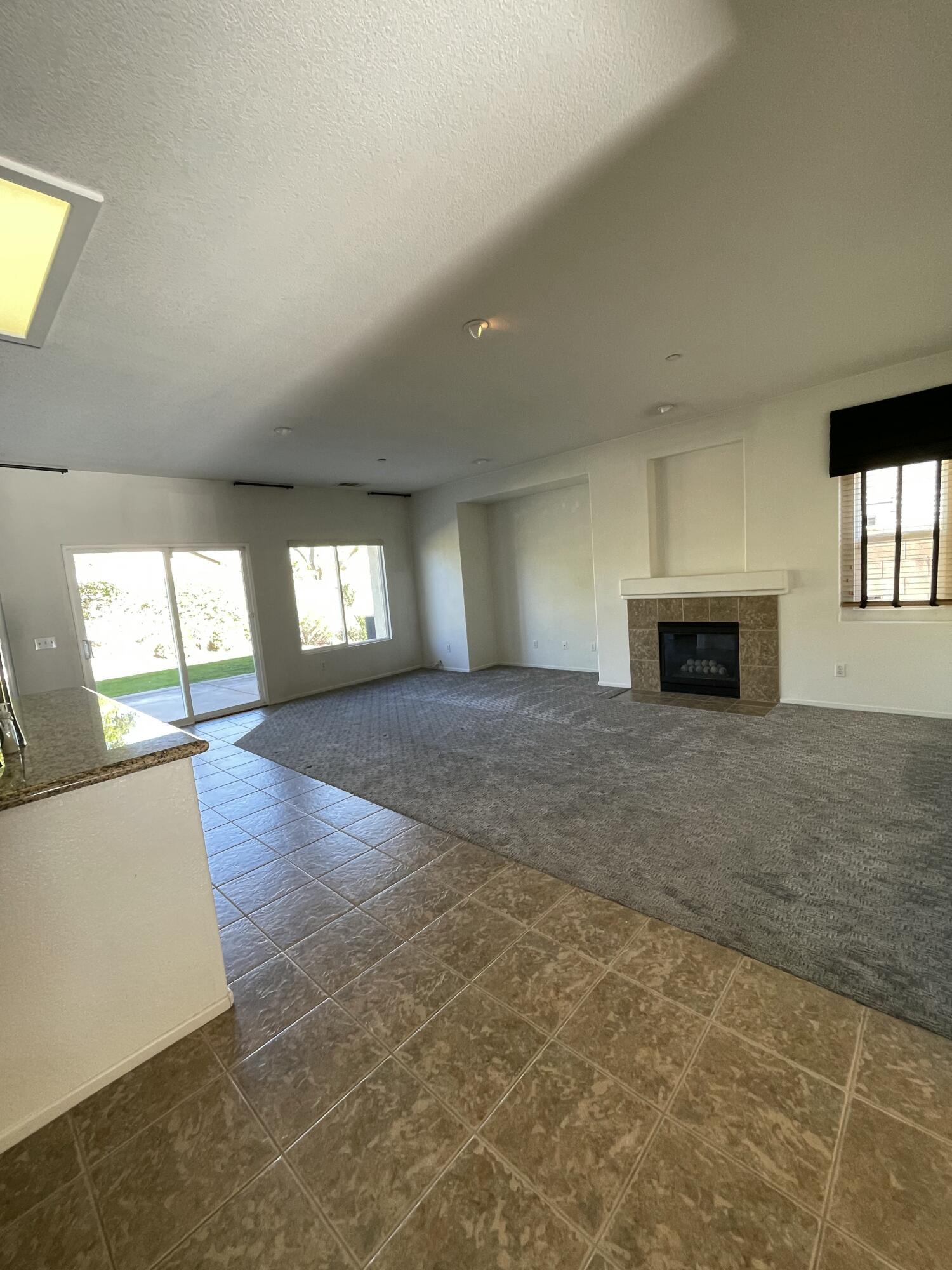 1122 Oro Ridge Palm Springs, CA 92262 - Photo 23 of 33 an empty room with windows and fireplace