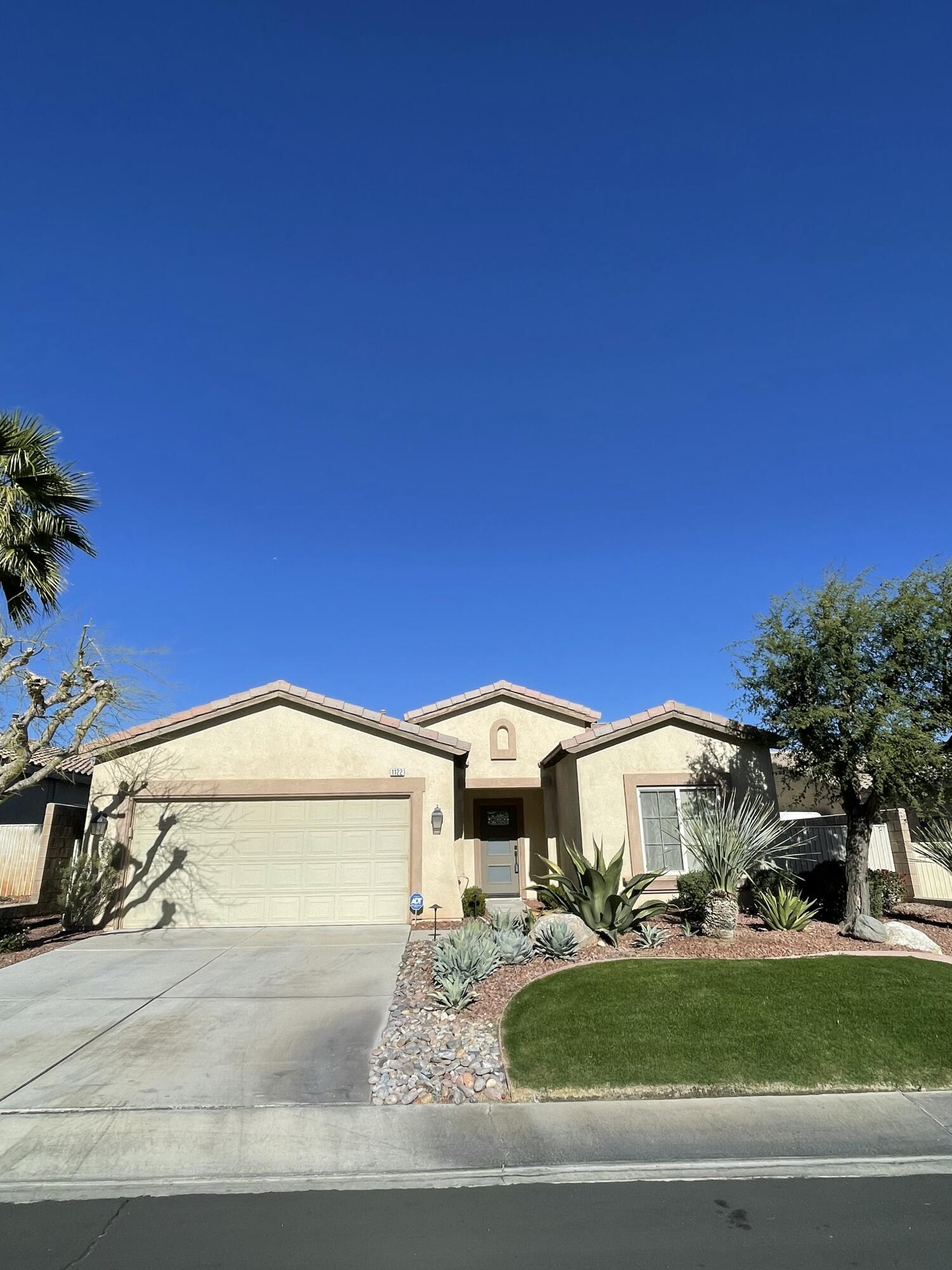 1122 Oro Ridge Palm Springs, CA 92262 - Photo 3 of 33 a view of a house with a swimming pool