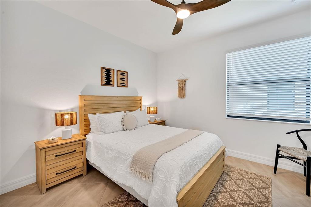 5822 Brandon Run Bradenton, FL 34211 - Photo 13 of 34 a bedroom with a bed and a window